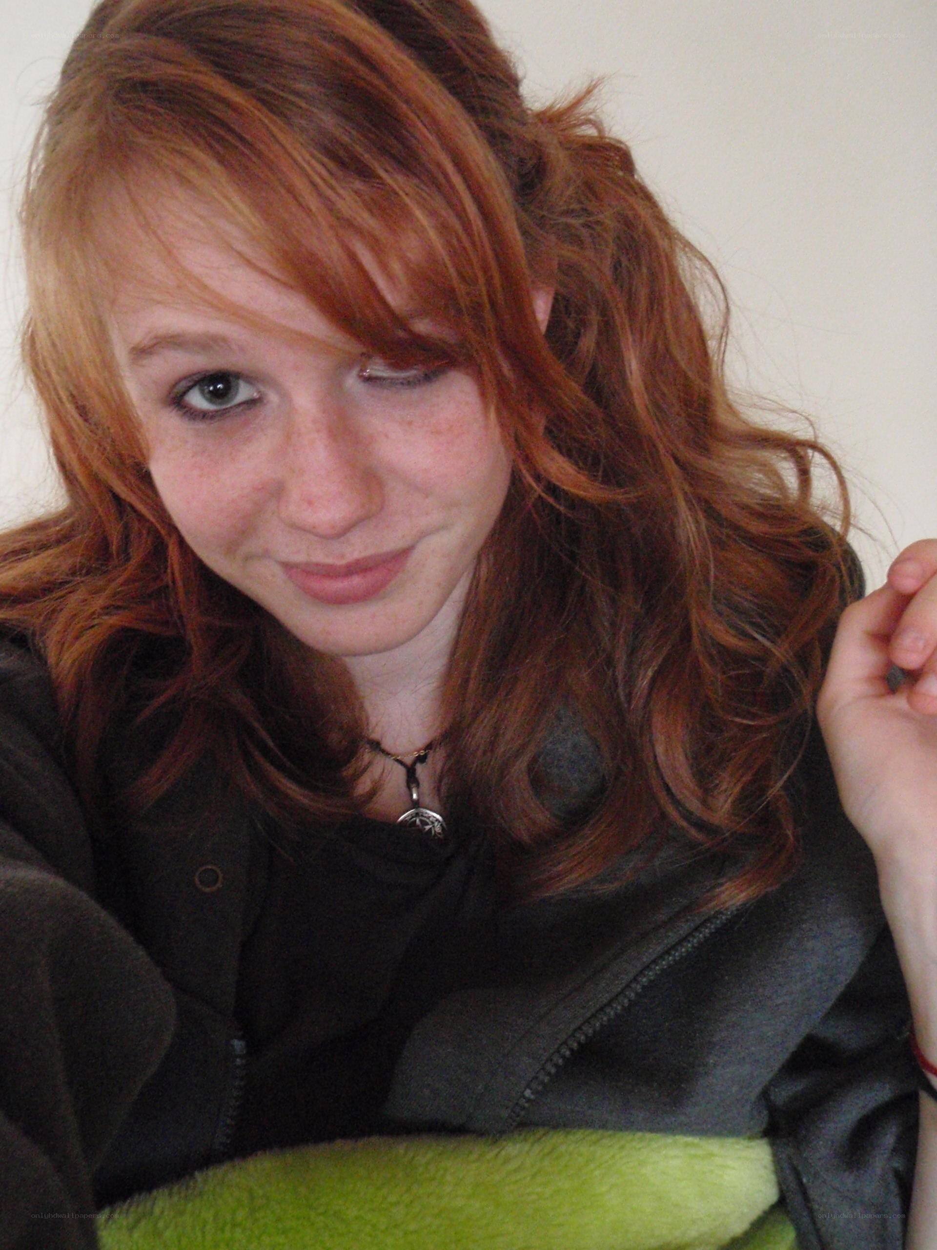 red-haired person in black jacket