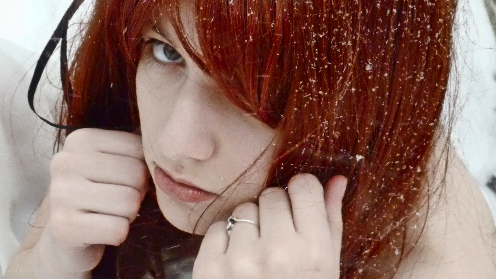 red-haired person in snow