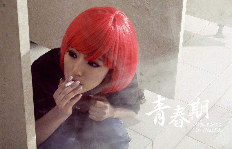 red-haired person smoking