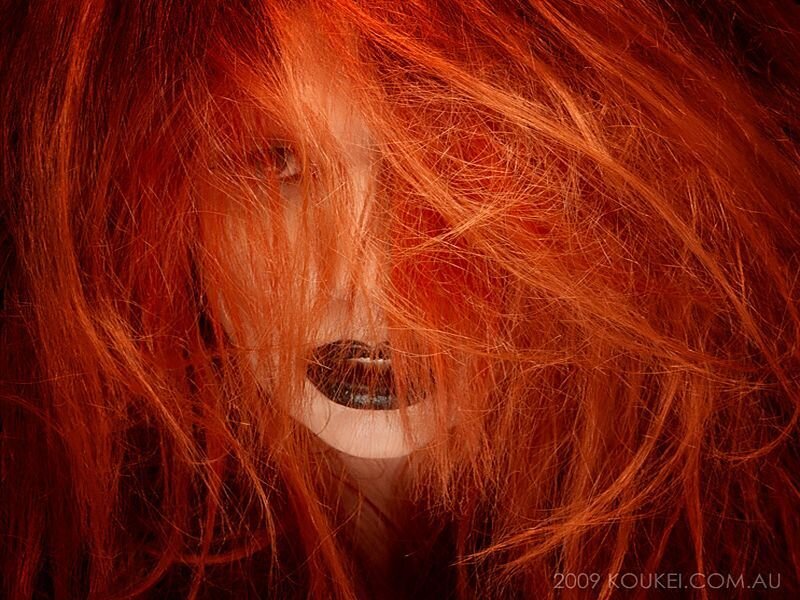 red-haired person with dark makeup
