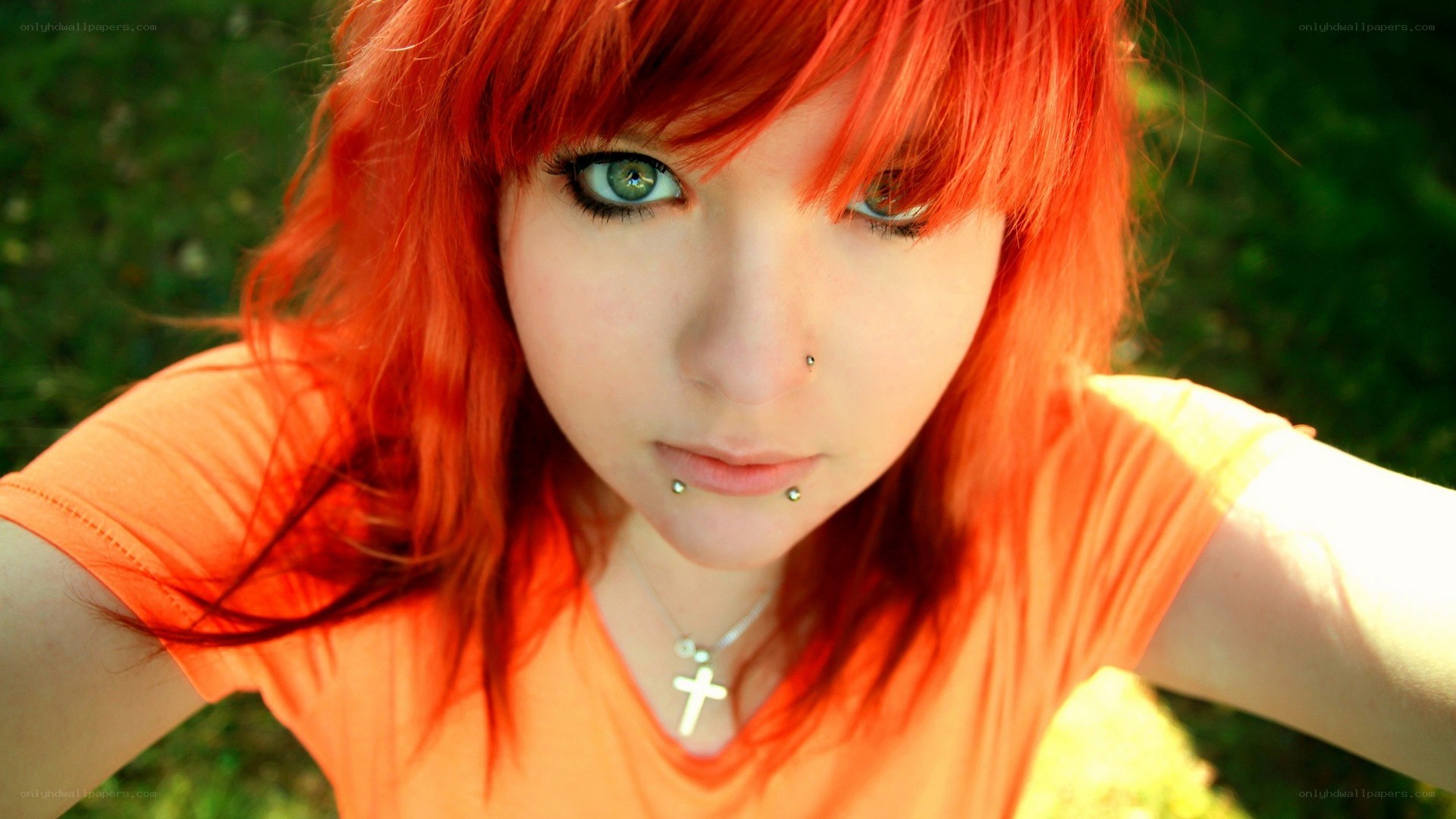 red-haired person with piercings