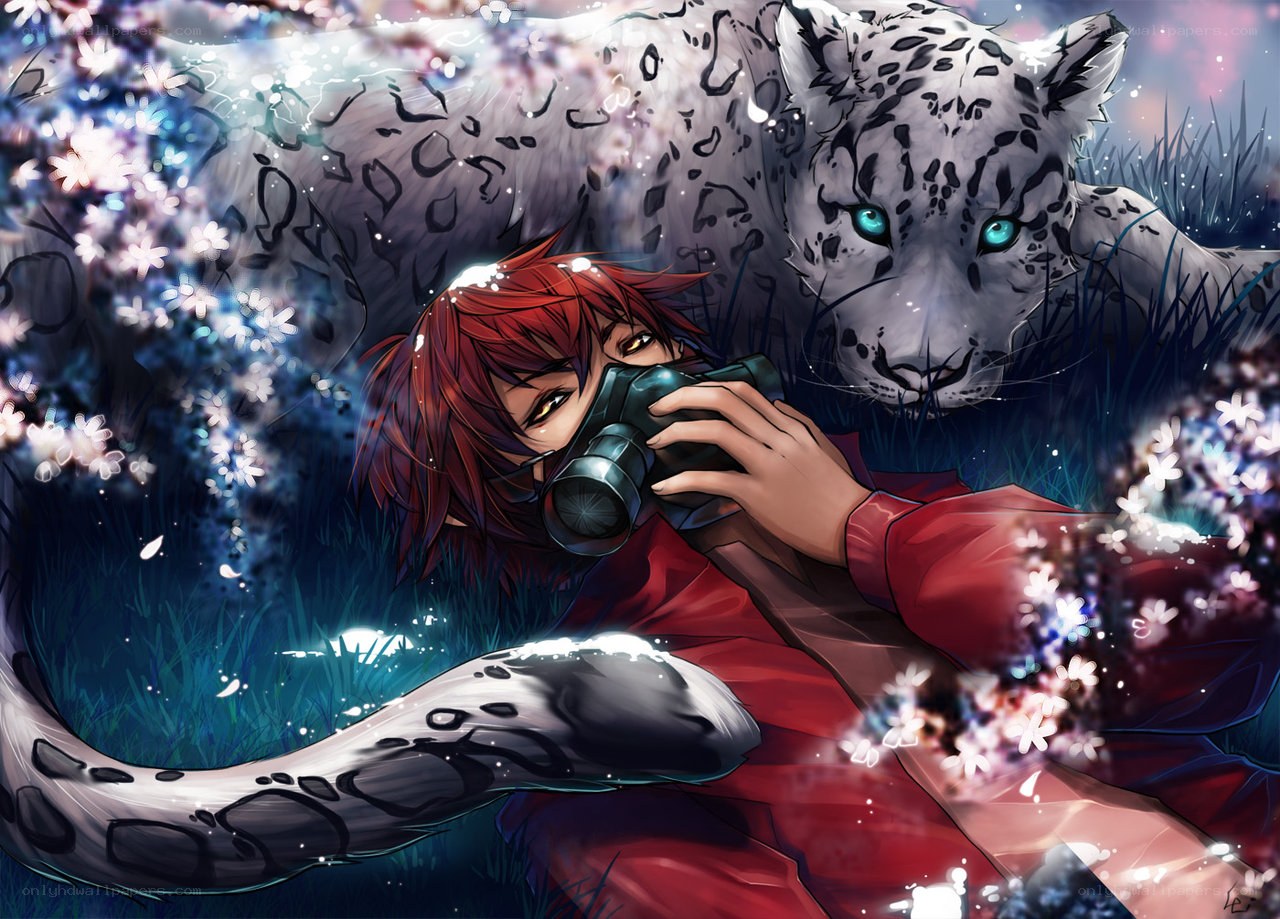 Red-haired photographer with snow leopard