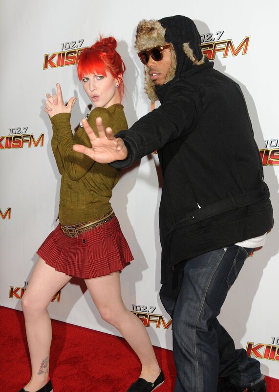 Red-haired woman and man on red carpet