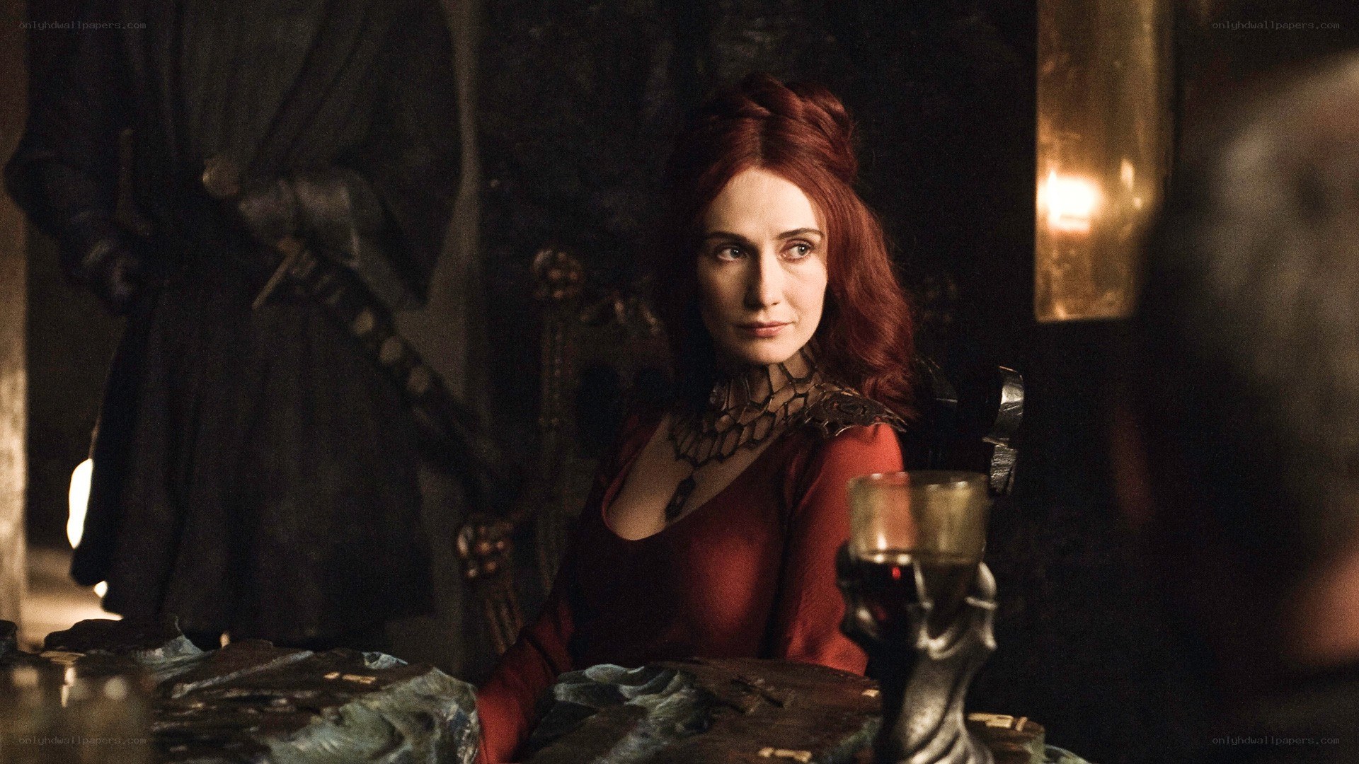 Red-haired woman at a table