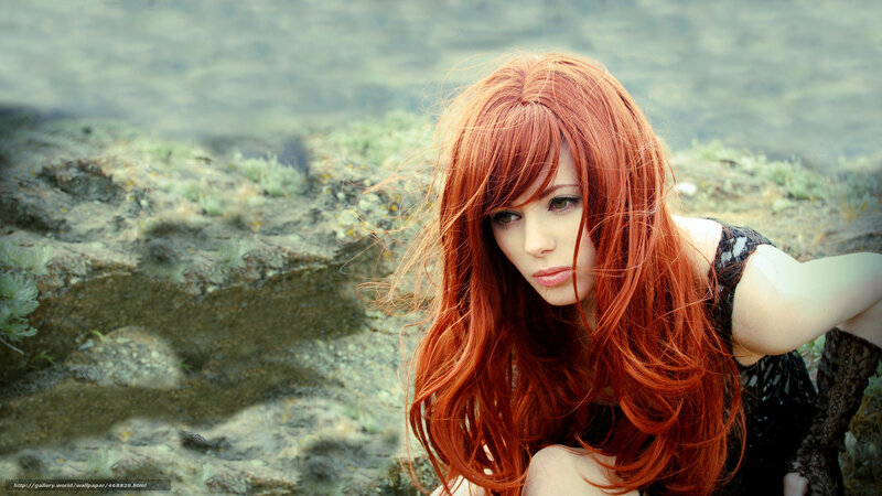 Red-haired woman by the water