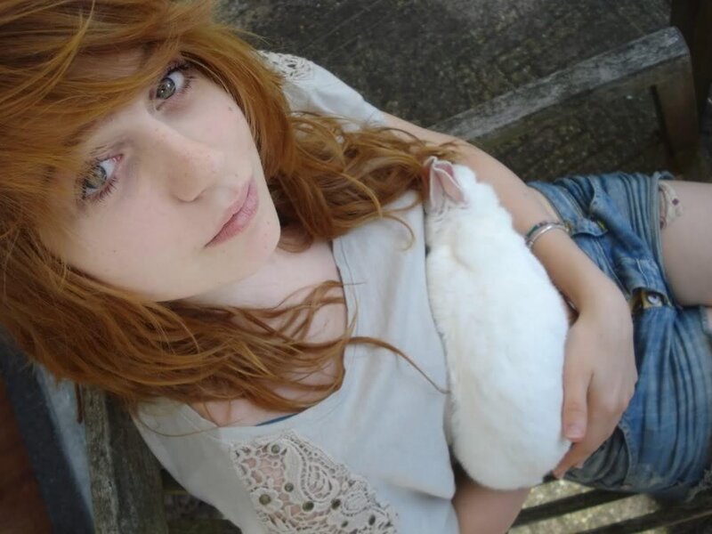 Red-haired Woman Holding Rabbit