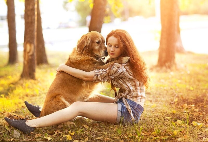 Red-haired Woman Hugging Dog