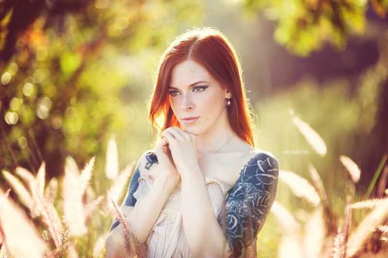 Red-haired woman in a field
