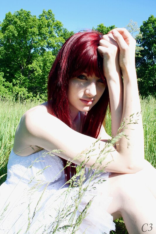 Red-haired woman in a field