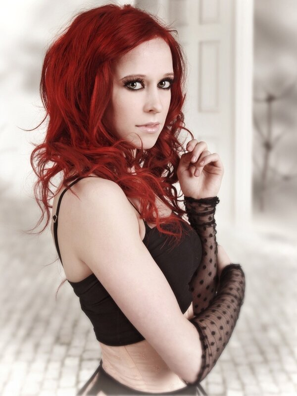 Red-haired woman in black top