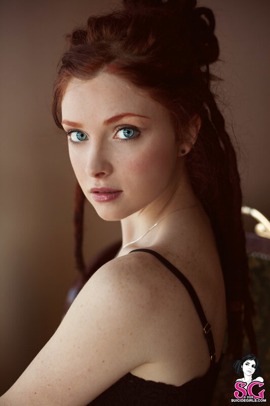 red-haired woman in black top
