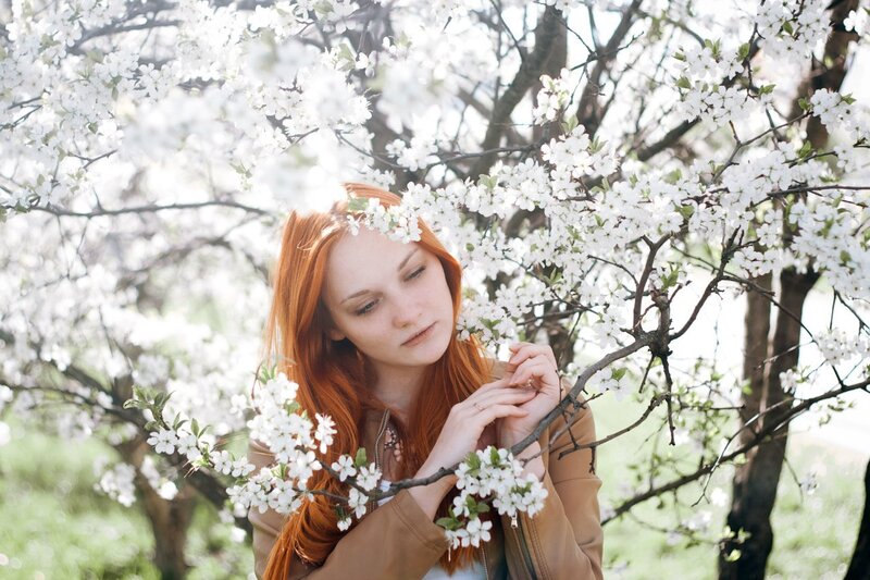 Red-haired Woman in Blossoms