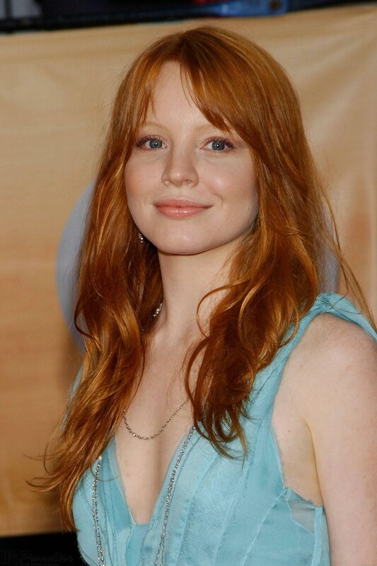 red-haired woman in blue dress