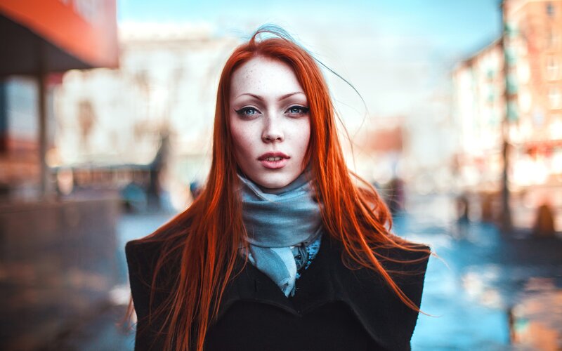 red-haired woman in city