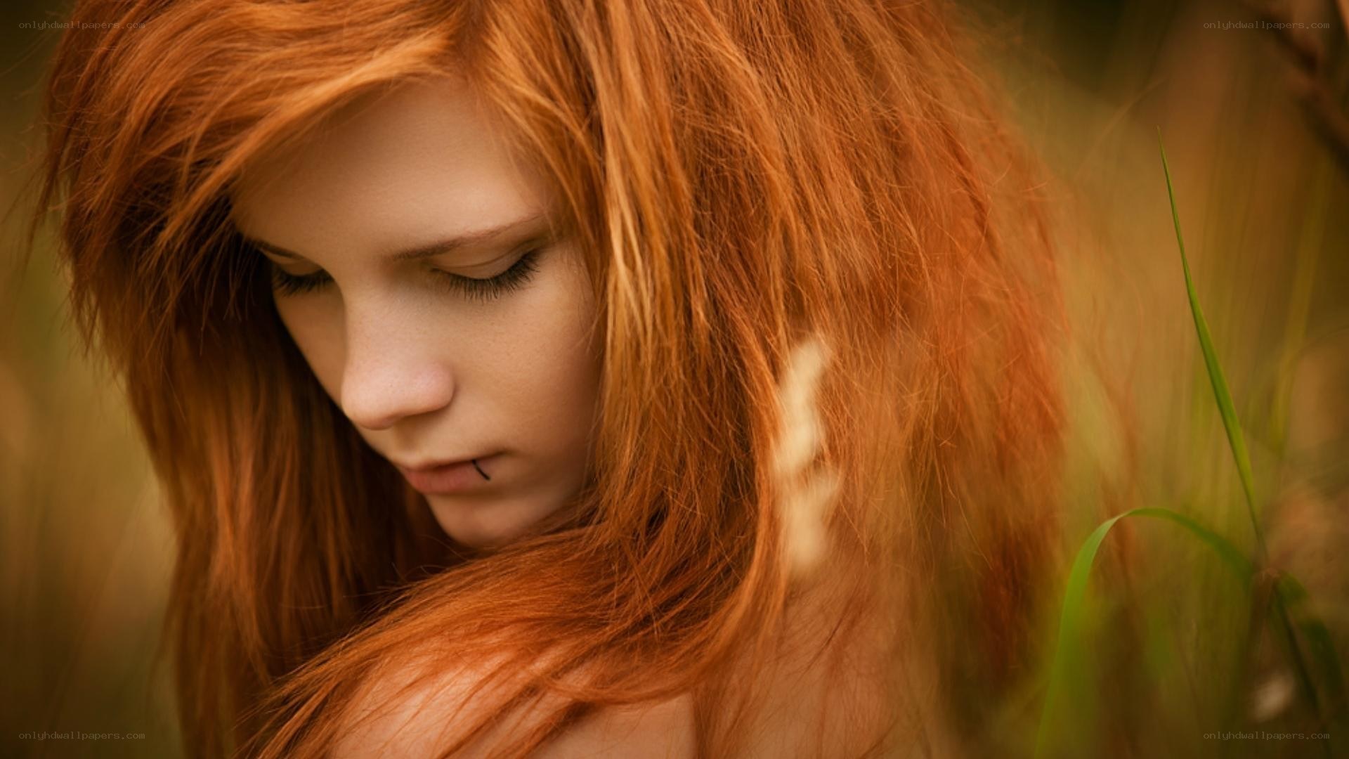 red-haired woman in field