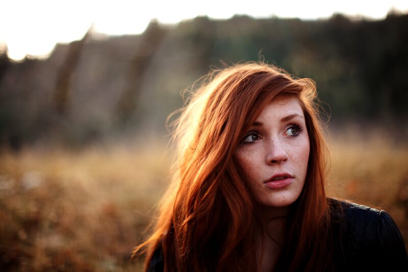 Red-haired Woman in Field — Red, Contemplative, Sunset