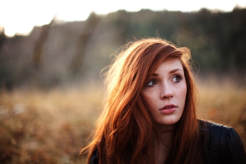 Red-haired Woman in Field — Red, Contemplative