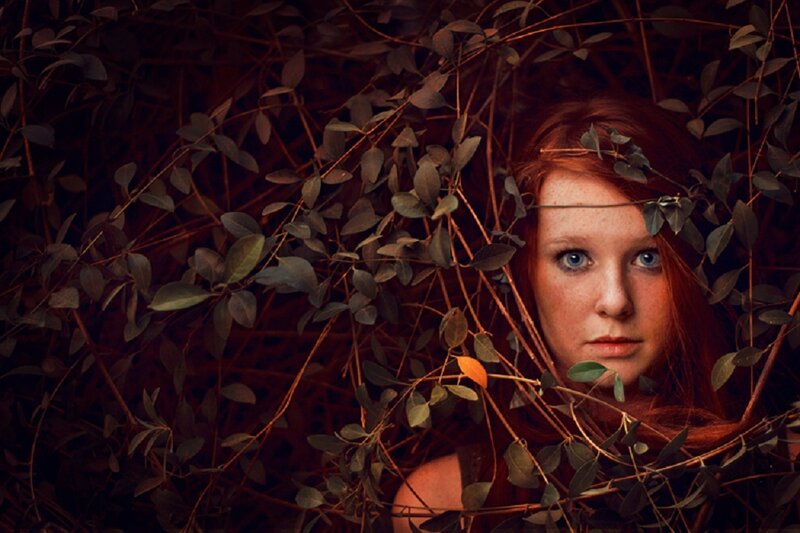Red-haired Woman in Foliage