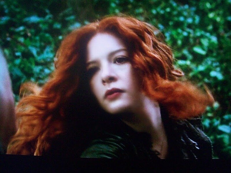 red-haired woman in forest