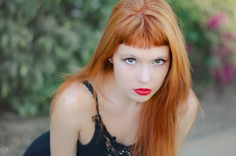 red-haired woman in garden