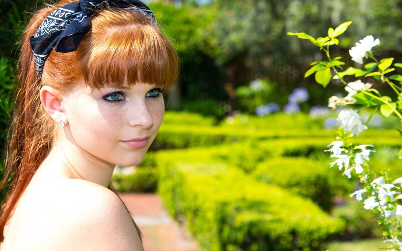 Red-haired woman in garden