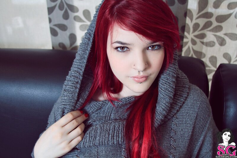 Red-haired woman in grey sweater