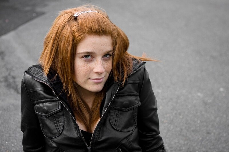 Red-haired woman in leather jacket