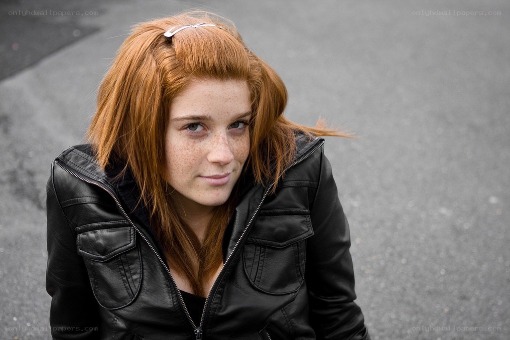 Red-haired woman in leather jacket