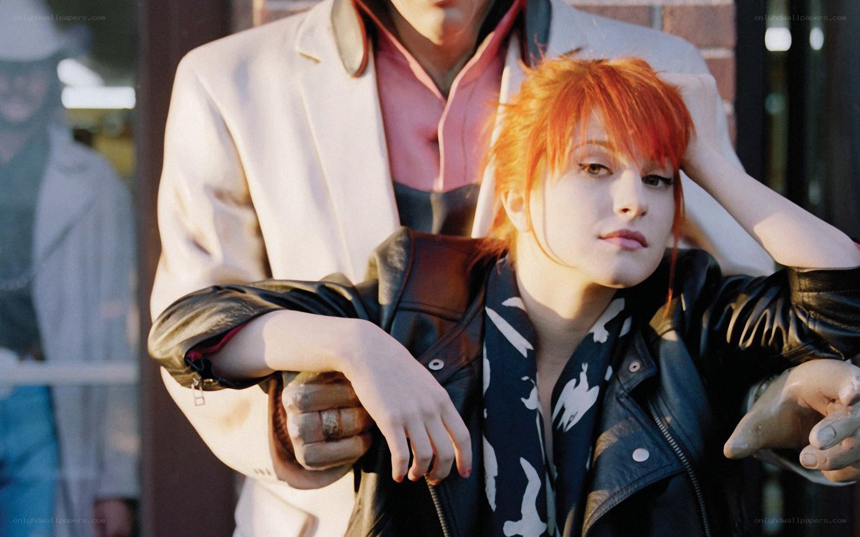 Red-haired woman in leather jacket