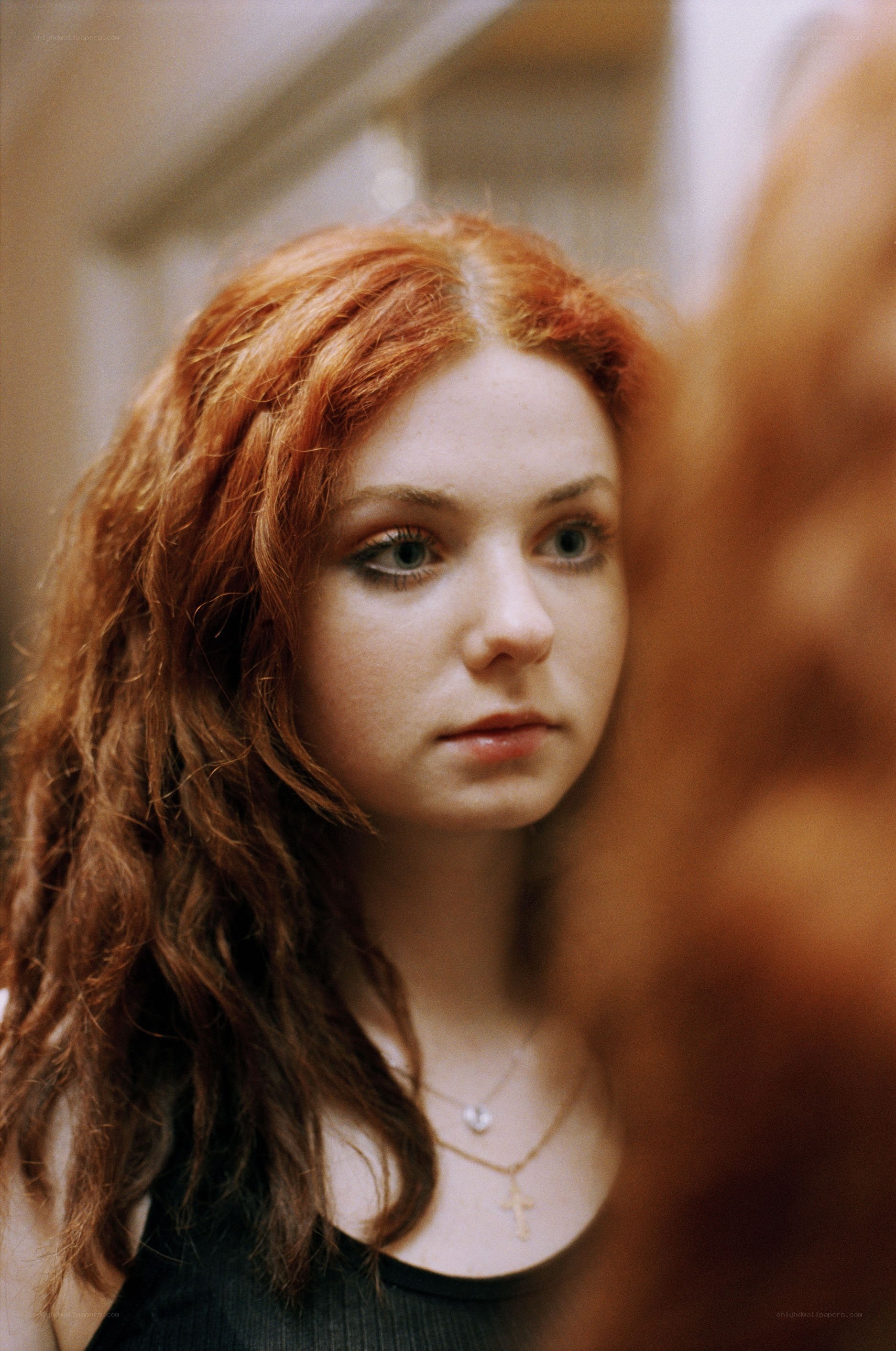 red-haired woman in mirror