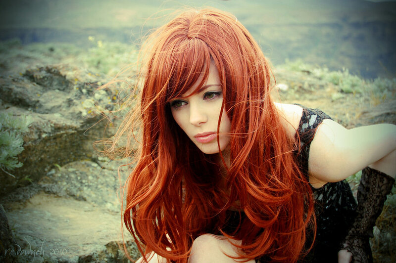 Red-haired woman in nature
