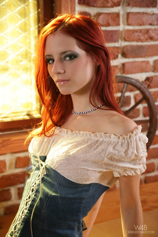Red-haired woman in off-shoulder top
