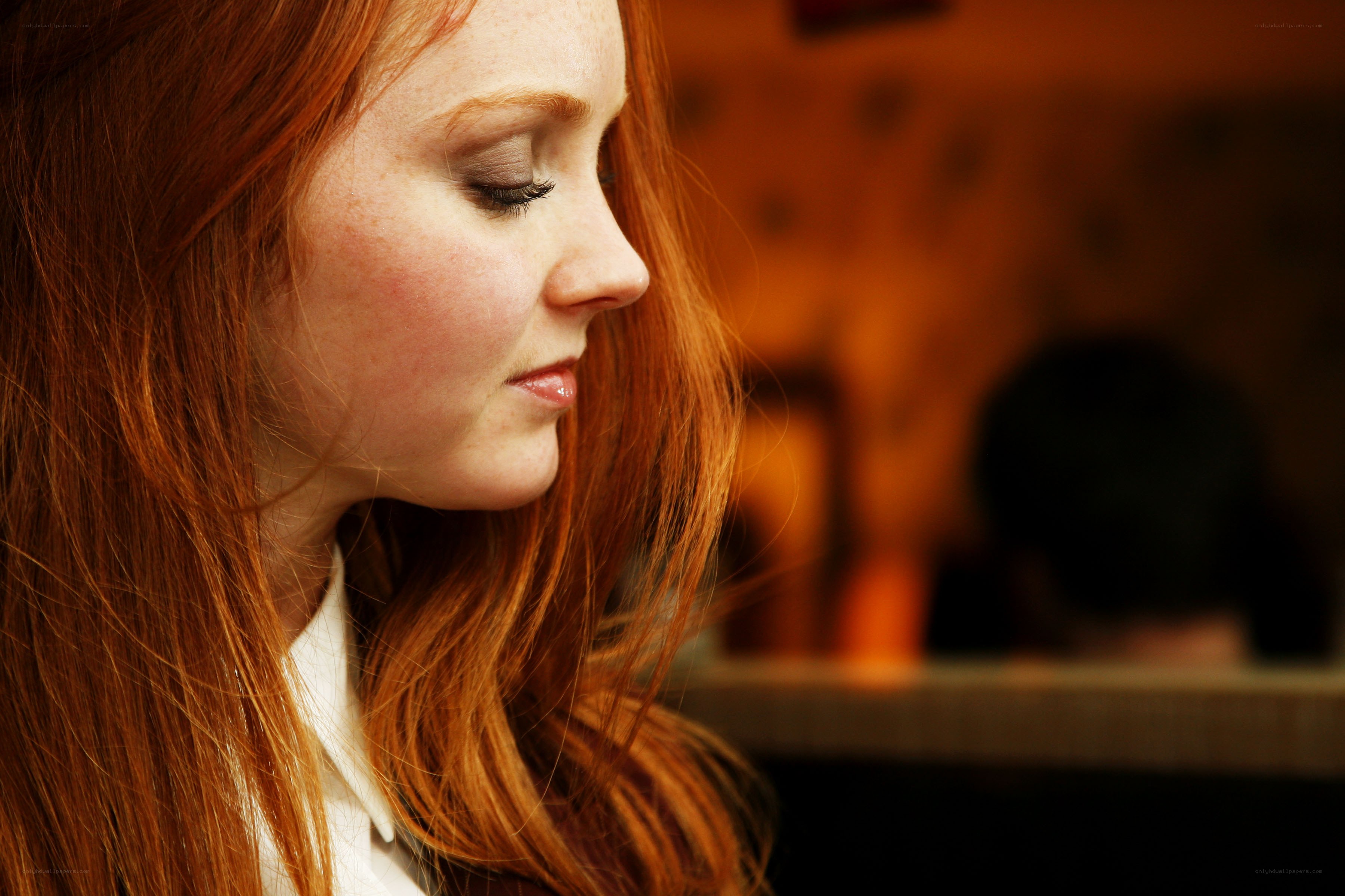 red-haired woman in profile