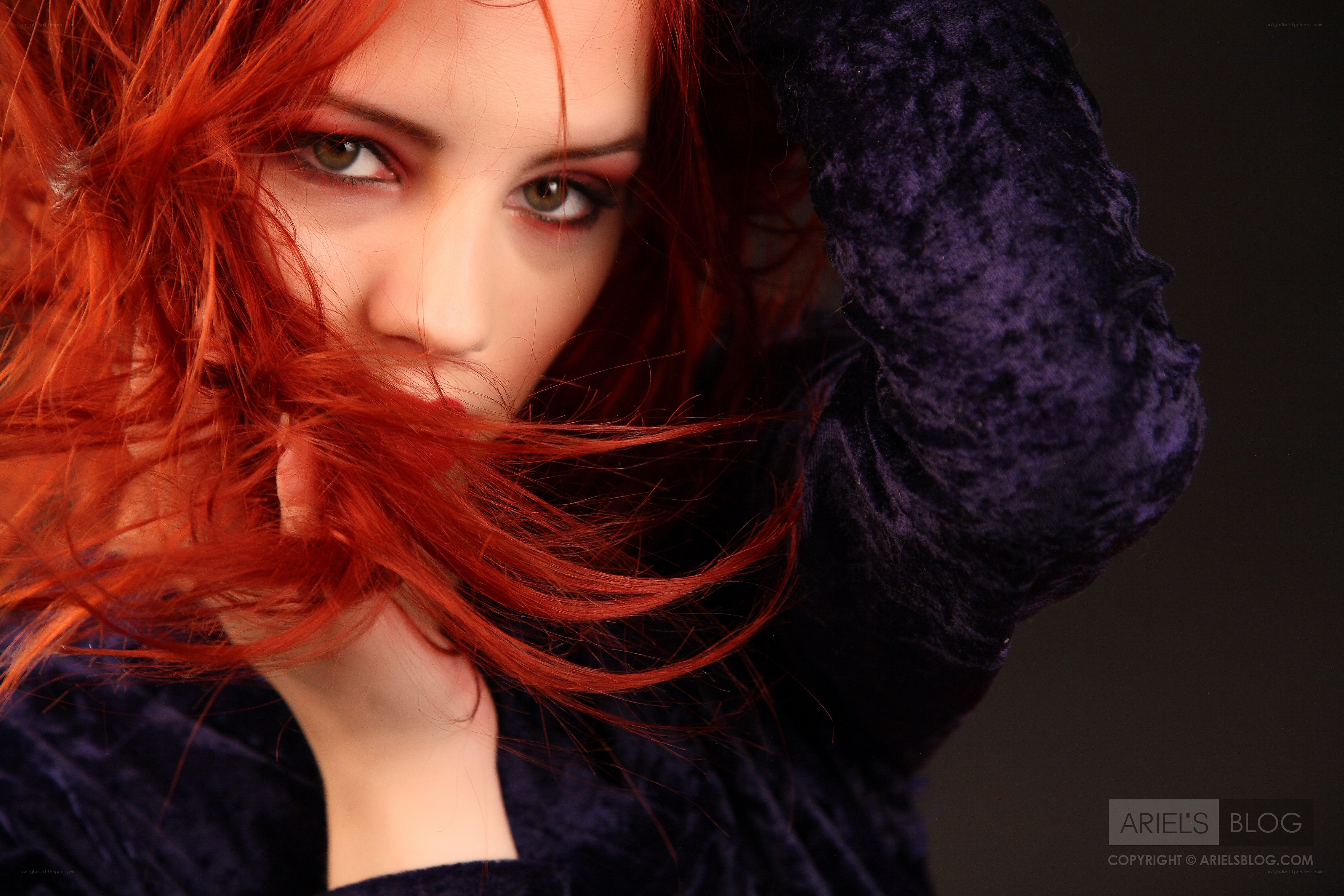 red-haired woman in purple