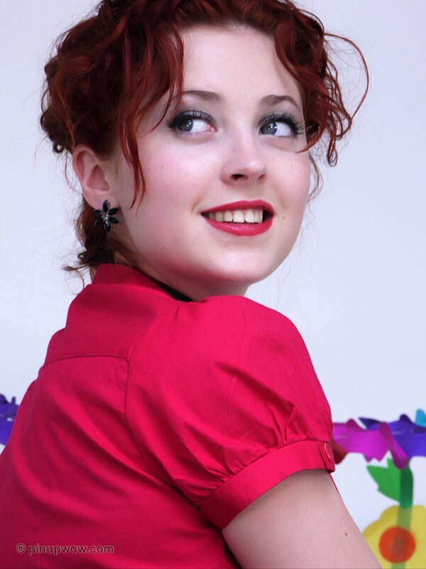 Red-haired woman in red dress