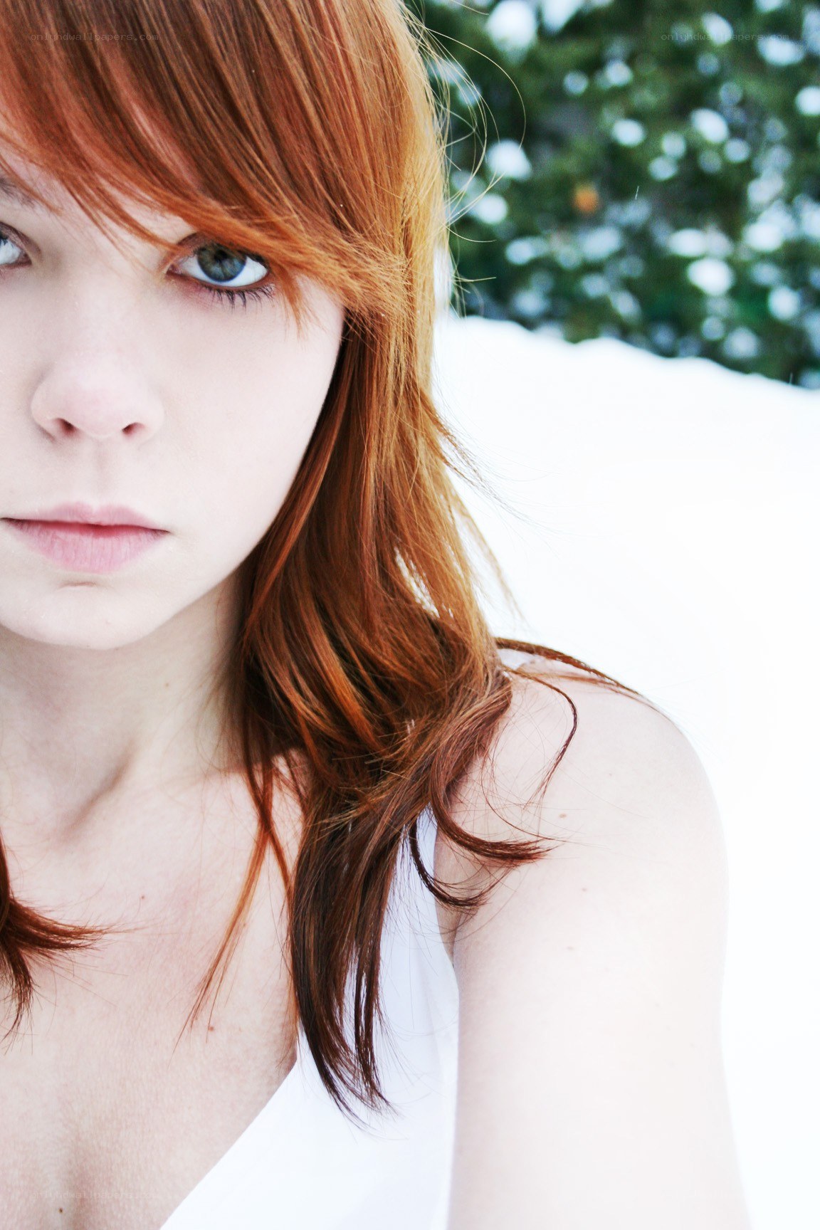red-haired woman in snow