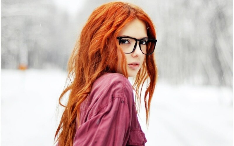 red-haired woman in snow
