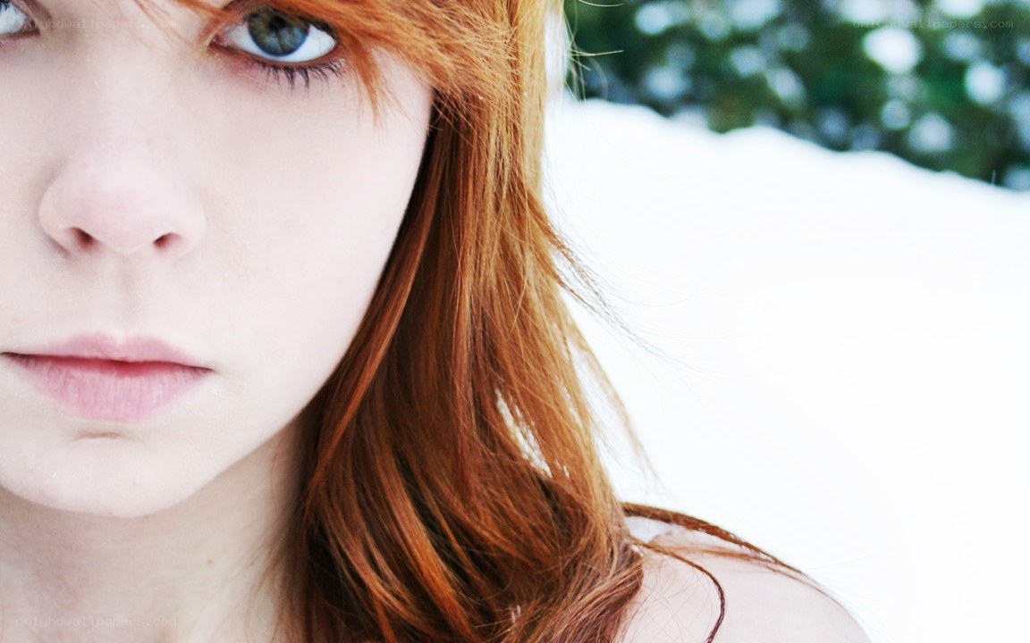red-haired woman in snow