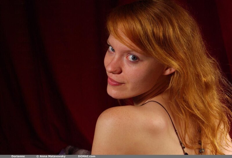 Red-haired woman in studio portrait