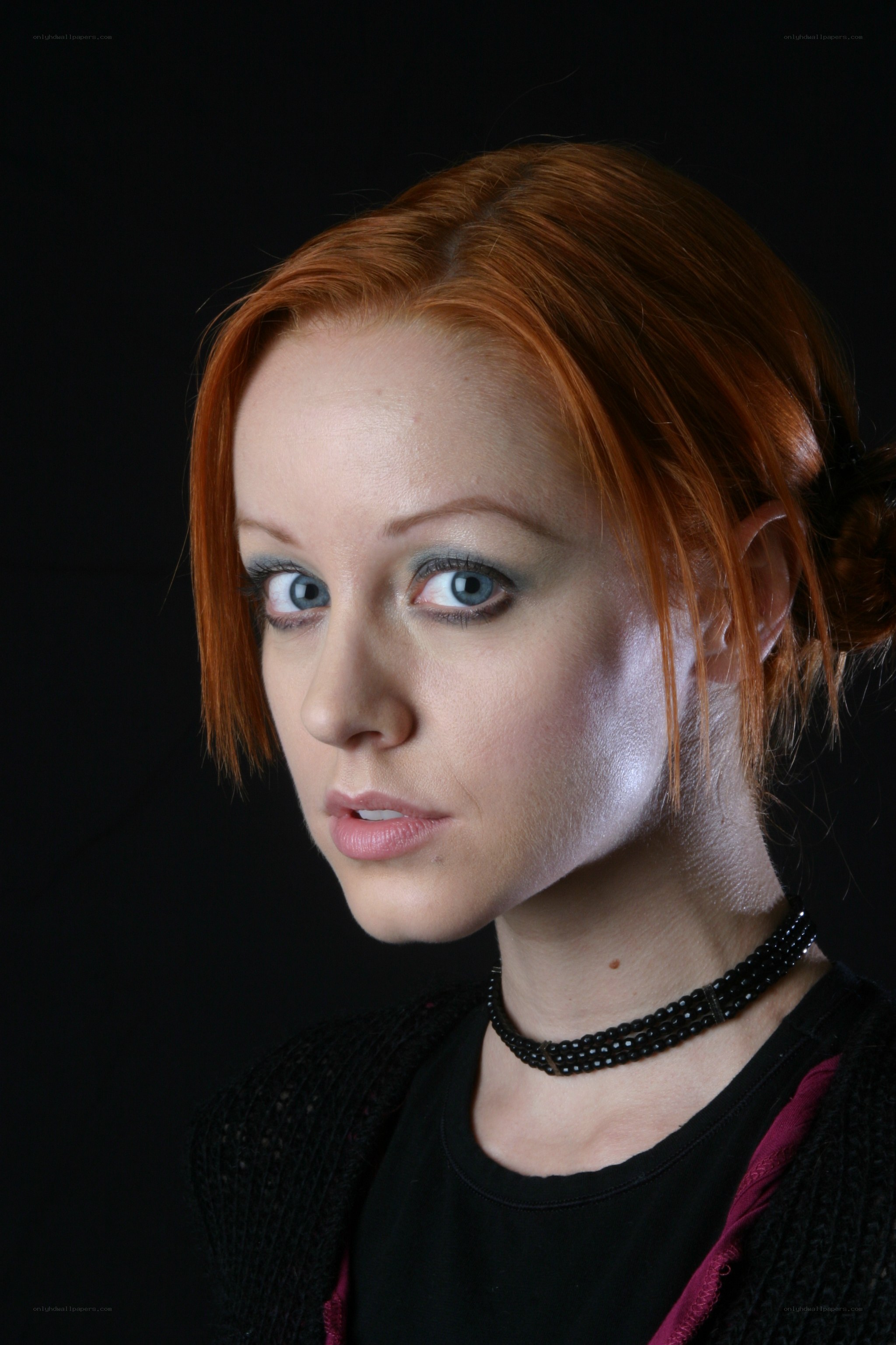 red-haired woman in studio portrait