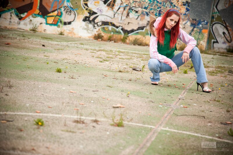 Red-haired woman in urban setting