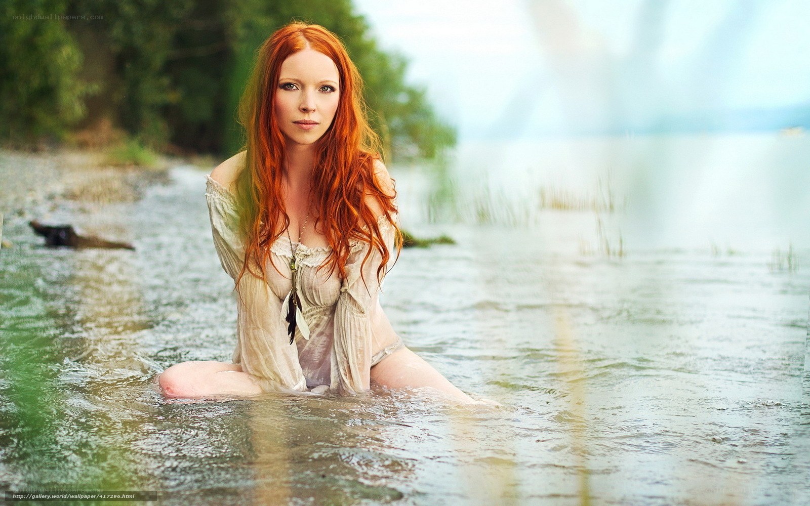 Red-haired woman in water