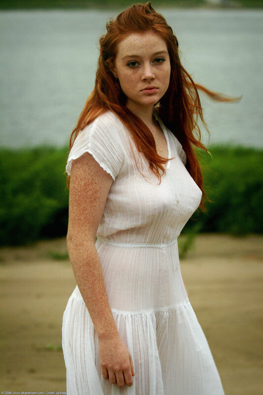 red-haired woman in white dress