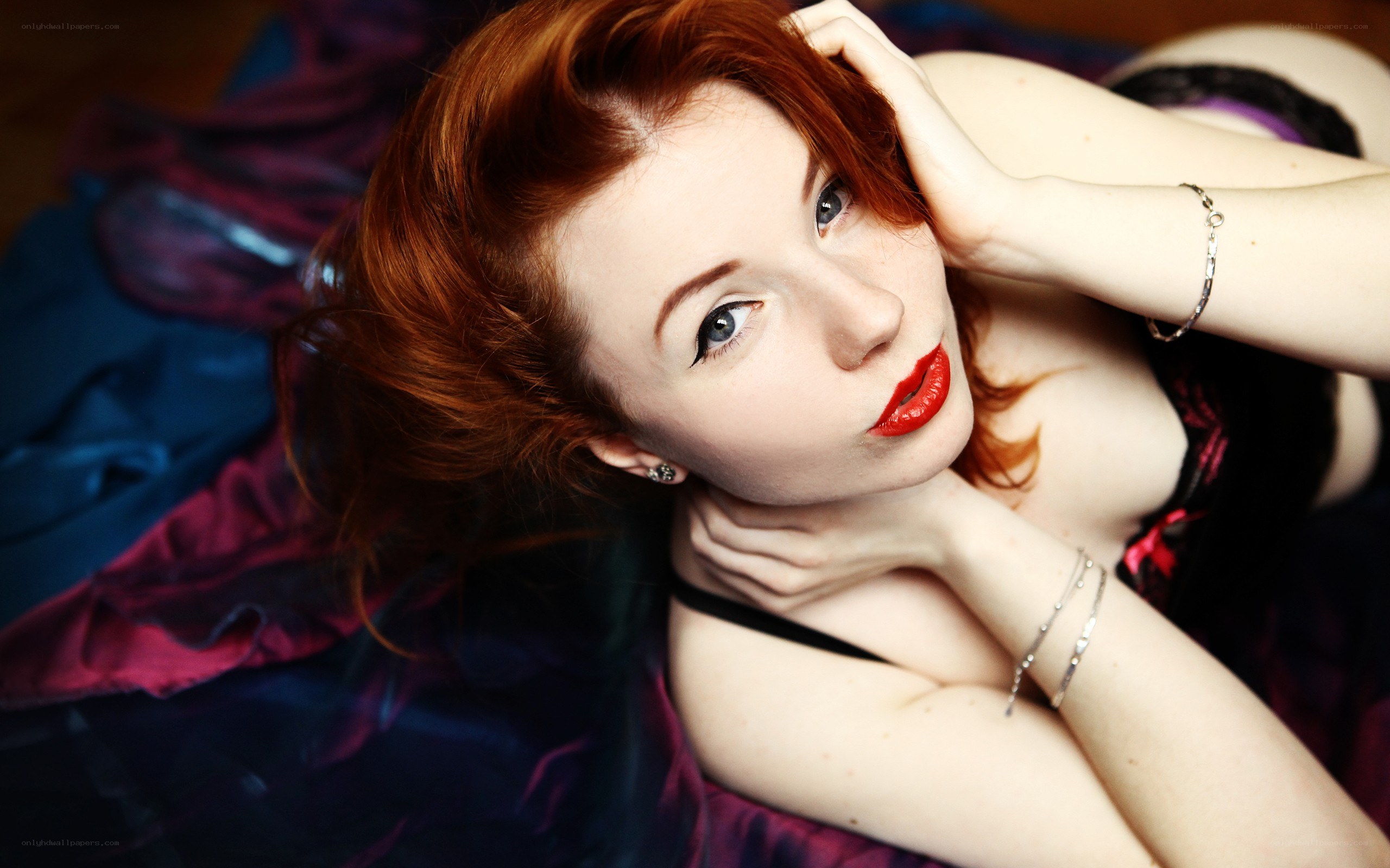 red-haired woman lying down