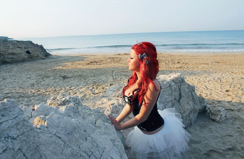 Red-haired woman on beach