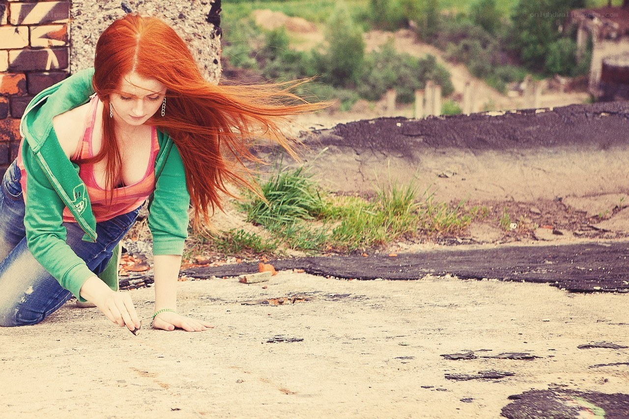 Red-haired woman on pavement