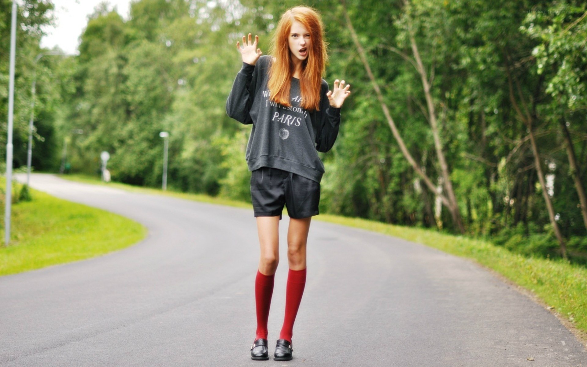 Red-haired woman on road
