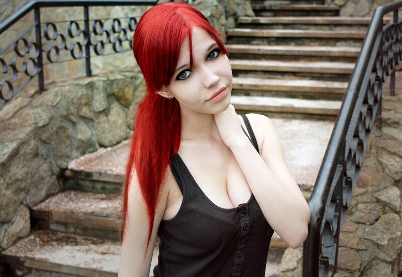 Red-haired woman on stone stairs
