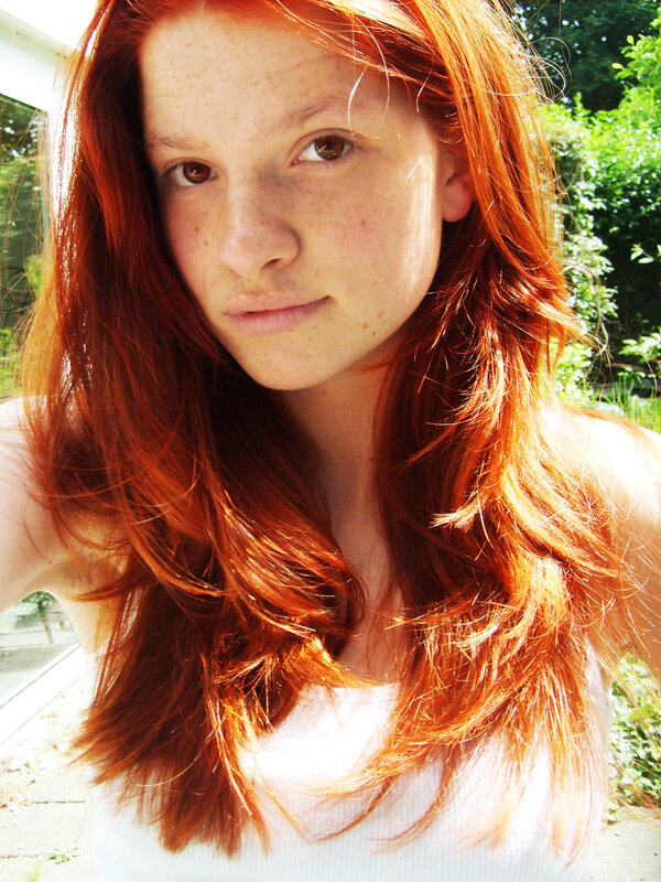 Red-haired woman outdoors