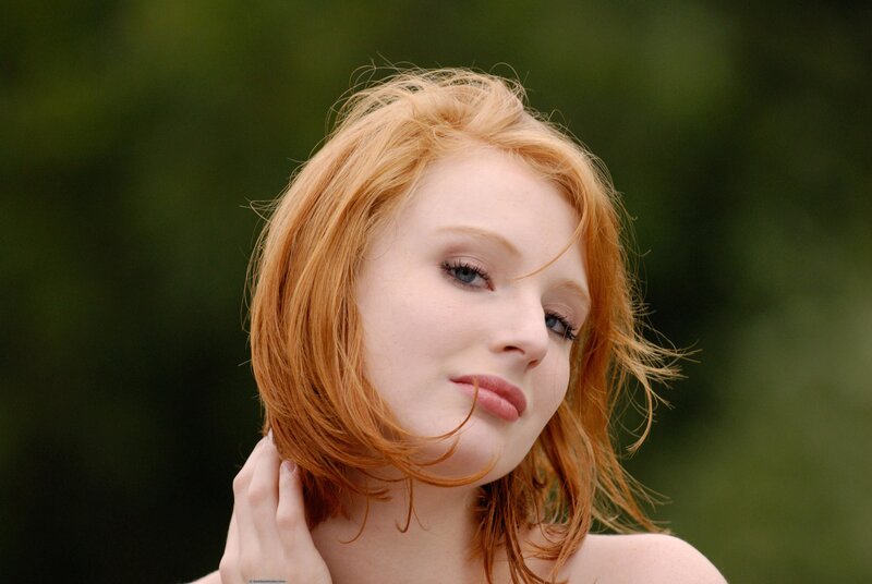 red-haired woman outdoors